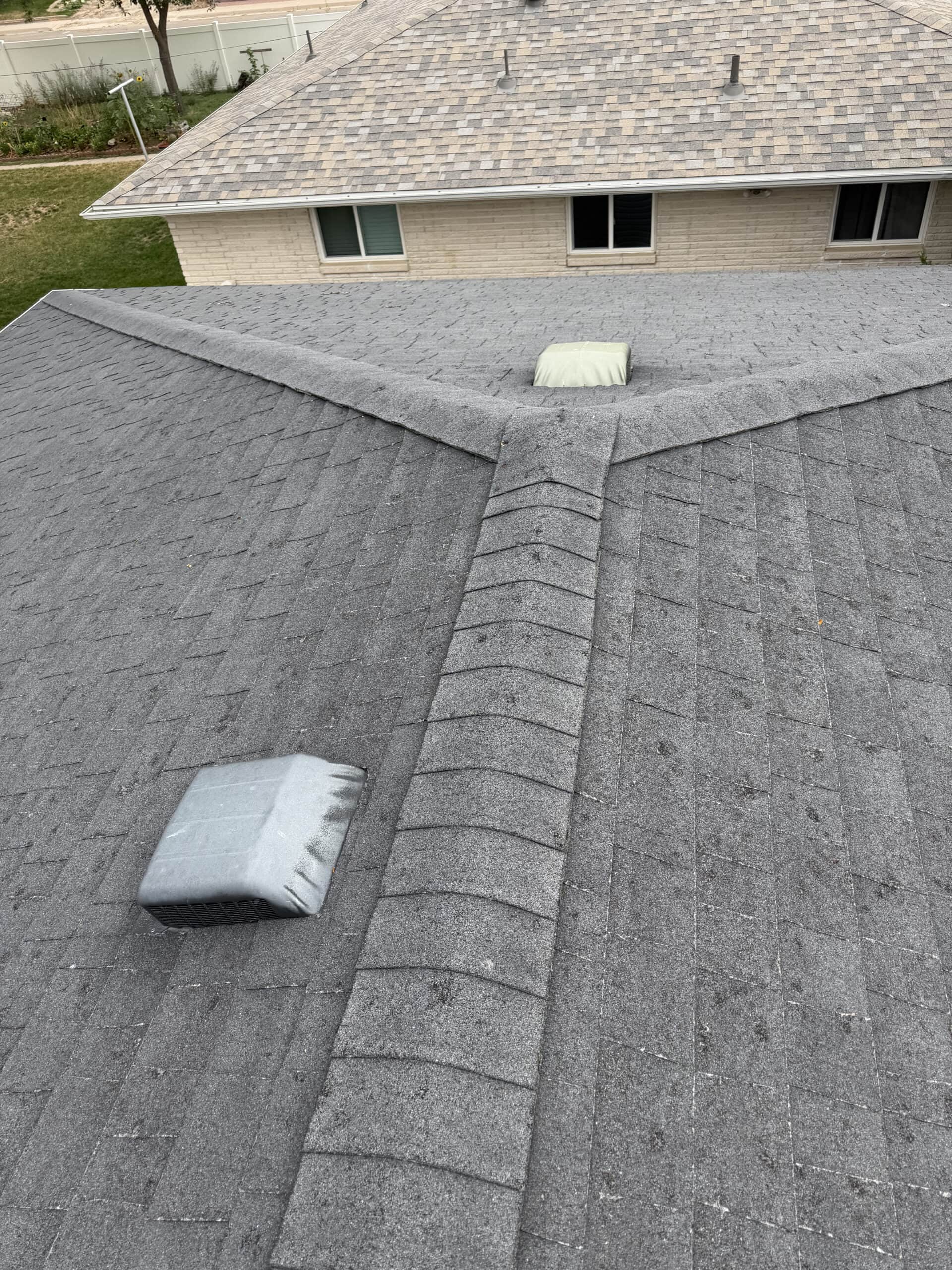 Roof ridge and surrounding shingles inspected during an RTII roof inspection in Fort Morgan, Colorado