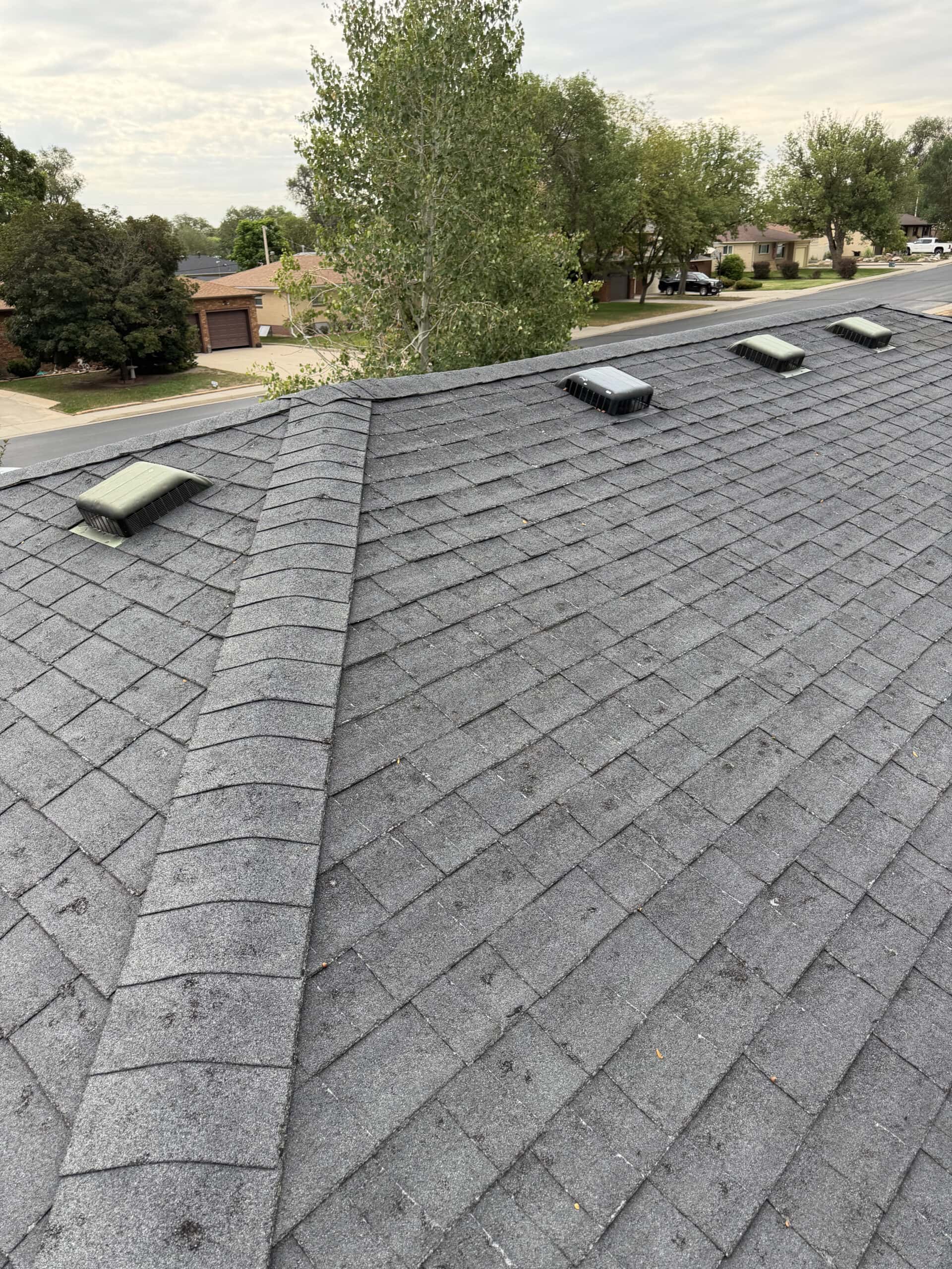 Roof ridge, shingles, and ventilation components inspected by RTII in Fort Morgan, Colorado
